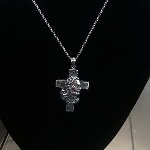Jesus face on cross with modern chain